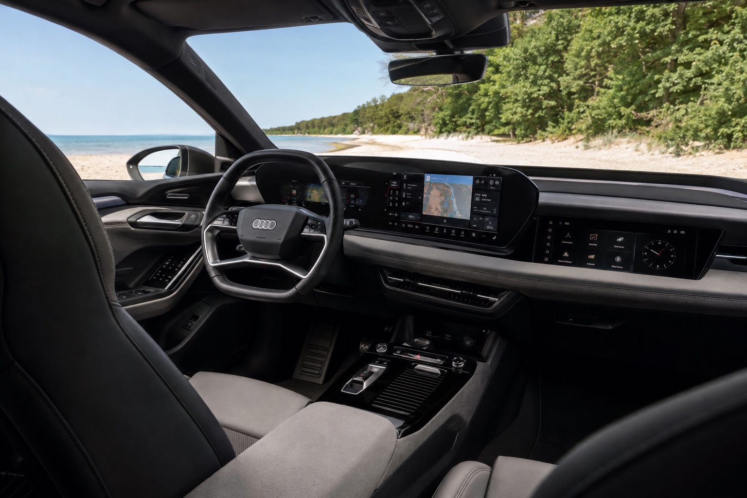 Audi A6 Sportback e-tron-kabine set skråt fra højre bagsæde med de fabriksmonterede skærme tændt