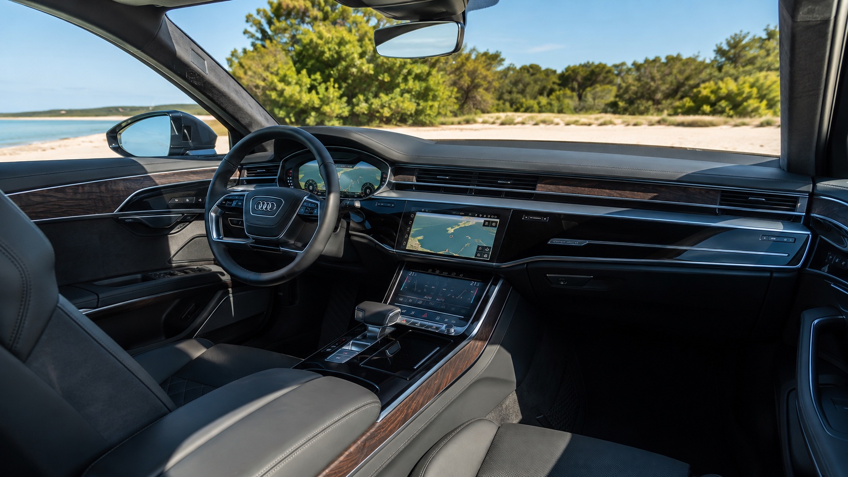 Audi A8 D5-interiør set fra højre bagsæde med Virtual Cockpit og begge MMI-skærme tændt