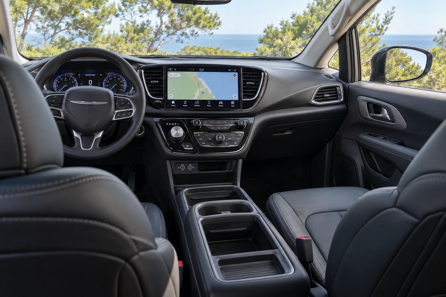 Chrysler Voyager-interiør med instrumenter og Uconnect-skærm tændt