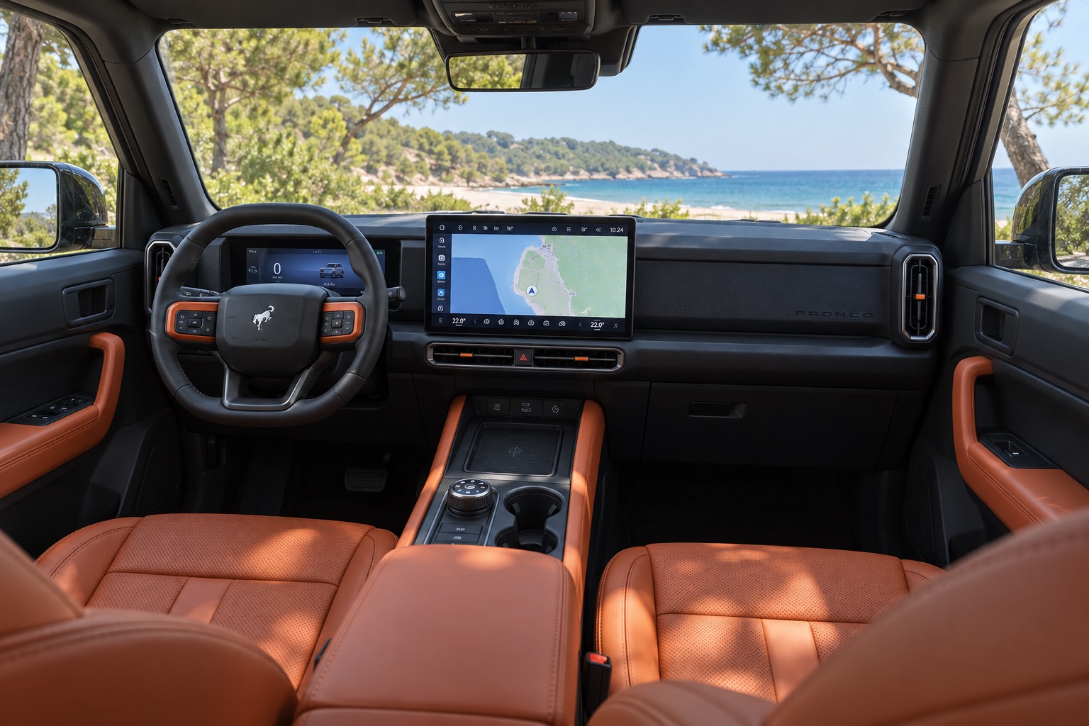 Ford Bronco New Energy med orange læder, tændt centerskærm og instrumentbord set fra højre bagsæde