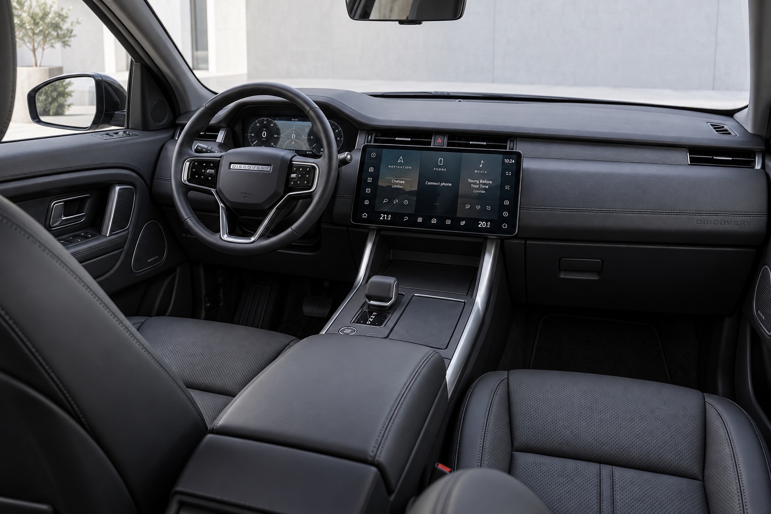 AI-illustration af den nyere Discovery Sport-kabine med buet touchskærm og digital instrumentering